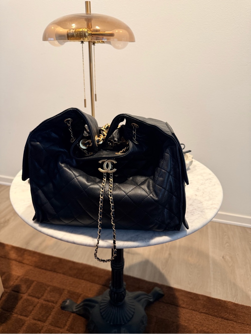 CHANEL Black Quilted Leather Shoulder Bag with Gold Chain and CC Logo